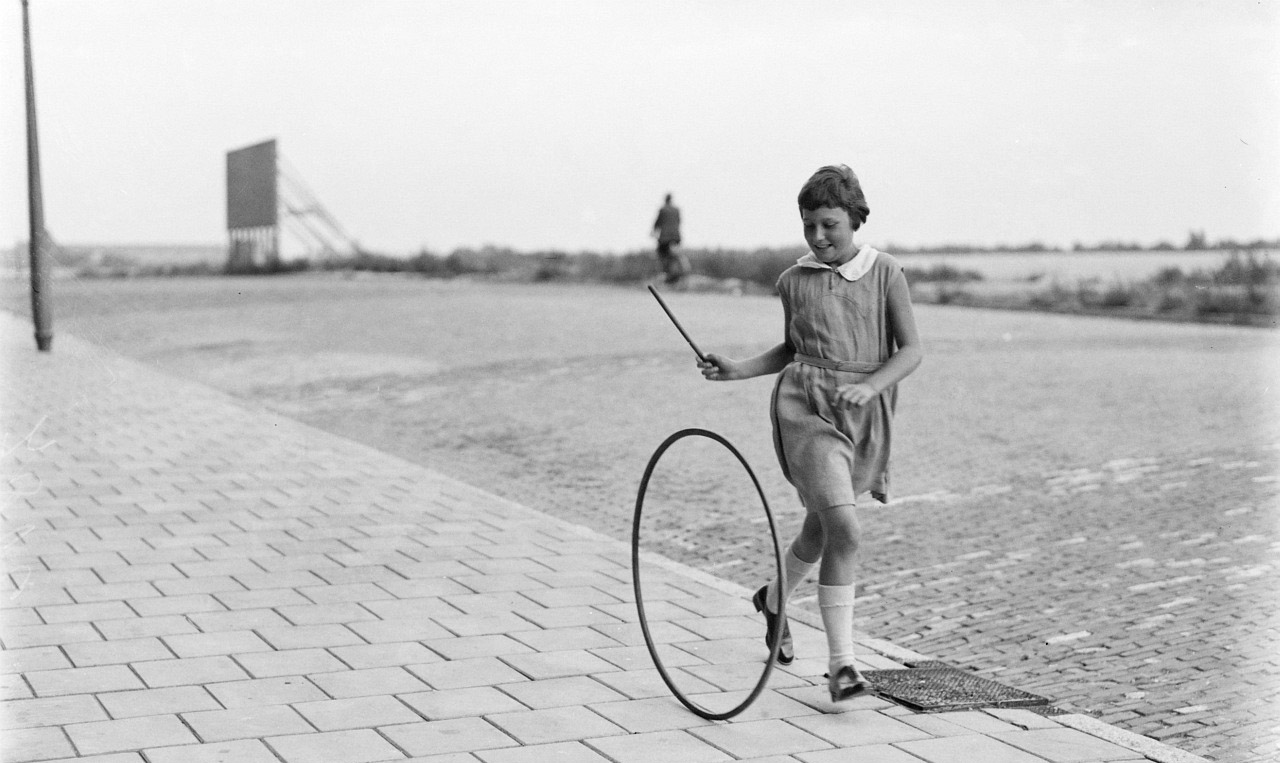 Litle Girl playing hula hoop